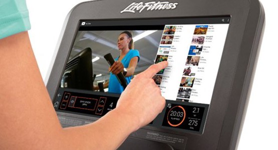 person using the settings on the treadmill